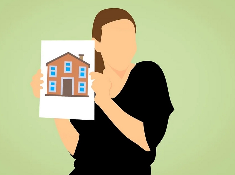 holding a picture of a house